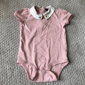 Victoria Beckham pink onesie with bee detail